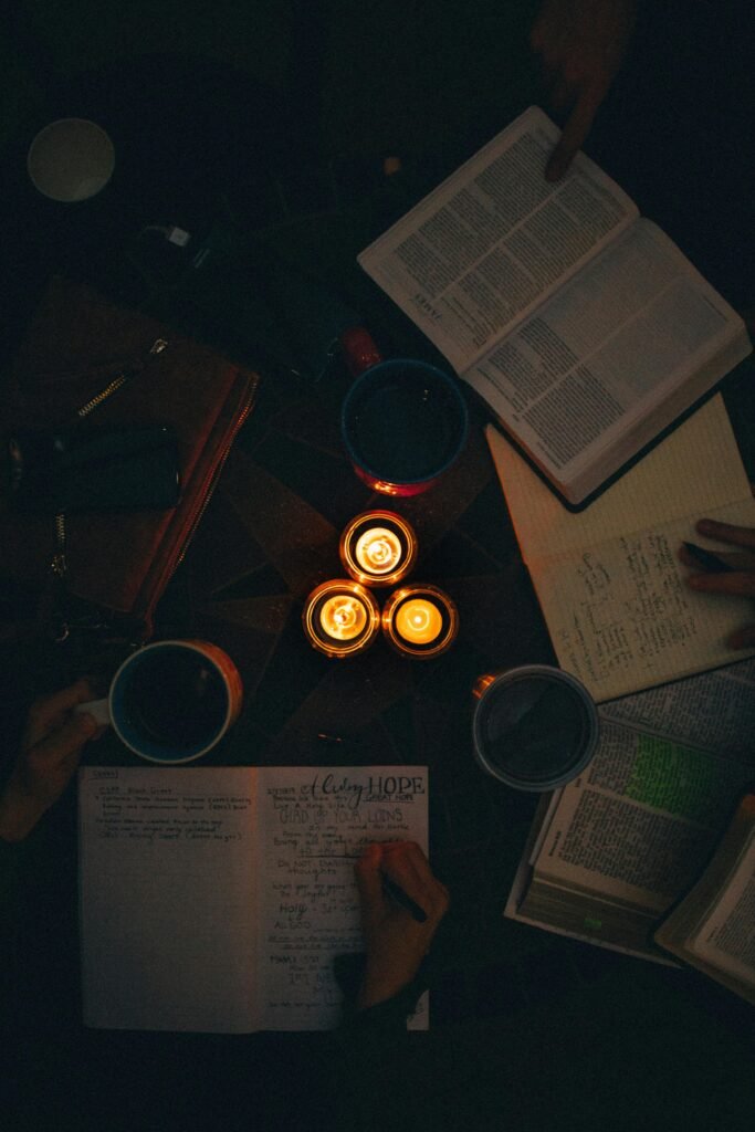 pexels-photo-1557251-1557251 A moody, candle-lit study session with open books and notes, perfect for cozy learning vibes.